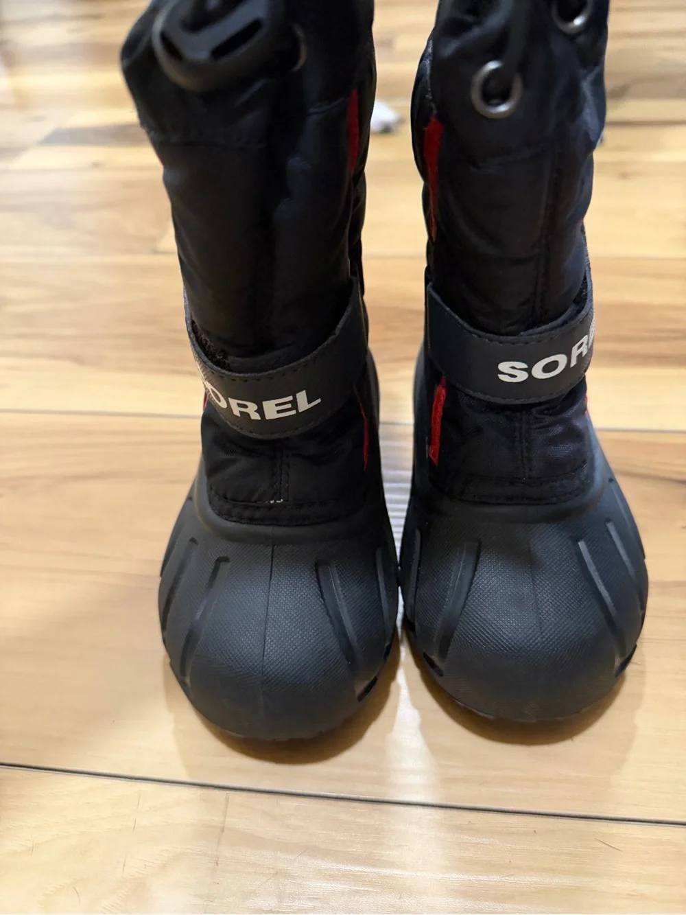 Sorel Kids Black Snow Boots with Red Accents